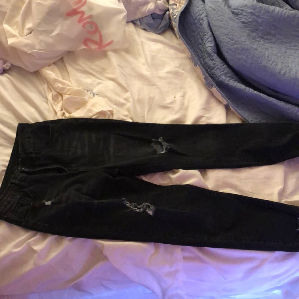 Black ripped jeans, never worn brand new.